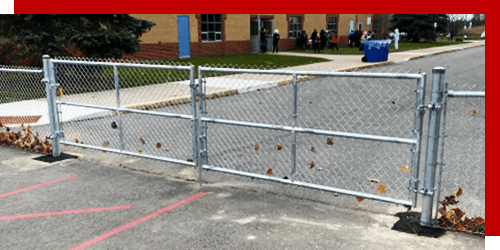 Security fencing gate in front of commercial building